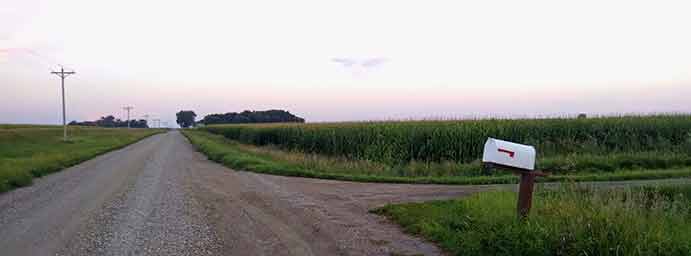 mail box on dirt road in the countryside photo