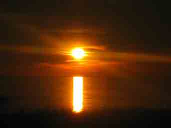 near sunset on red lake with clouds and cattails Minnesota photo